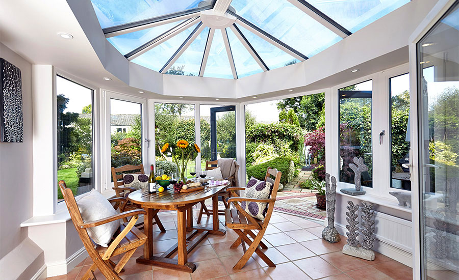 interior of conservatory with dining table and chairs