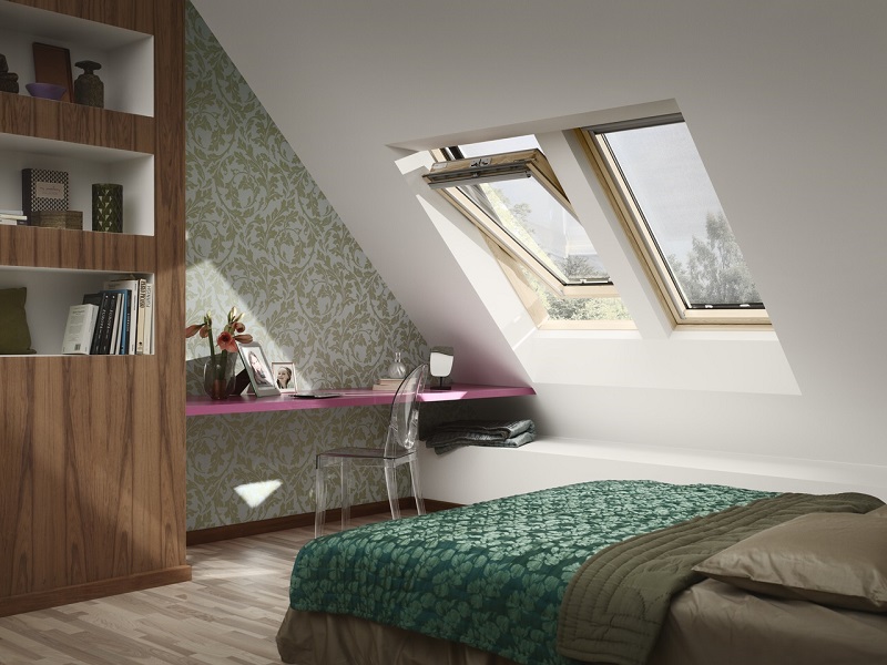bedroom with bed, desk and roof windows