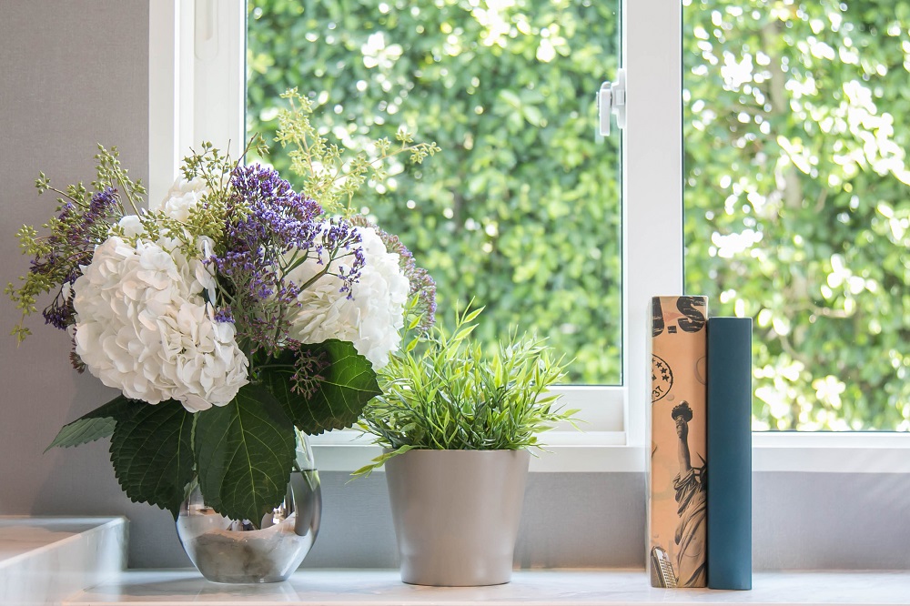 windowsill with flowers and books