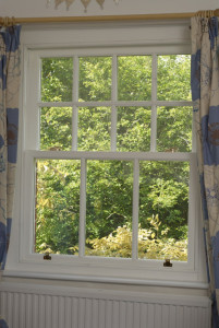 White timber sliding sash window by Anglian Home Improvements myglazing ggf