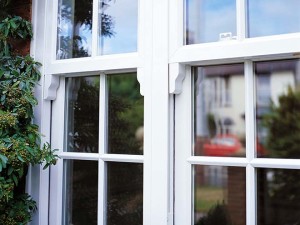 outside of upvc sash windows with reflections