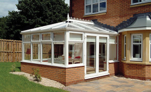Elizabethan conservatory with French doors by Anglian Home Improvements myglazing ggf