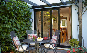 Black aluminium patio door by Anglian Home Improvements myglazing ggf