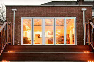 Orangery with bi-folding doors by Anglian Home Improvements myglazing ggf