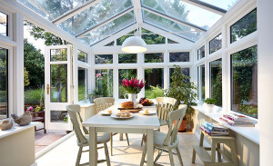 White timber Regency conservatory by Anglian Home Improvements myglazing ggf