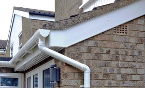 uPVC gutters and downpipe with white bargeboards by Anglian Home Improvements myglazing ggf