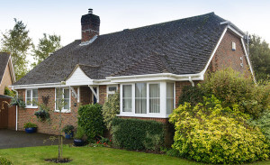 Bungalow featuring white uPVC windows, fasicas, soffits and guttering by Anglian Home Improvements myglazing ggf
