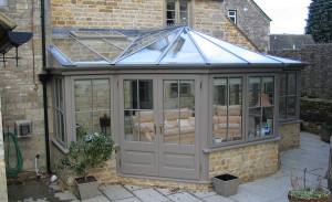 T-shaped timber conservatory by Anglian Home Improvements myglazing ggf
