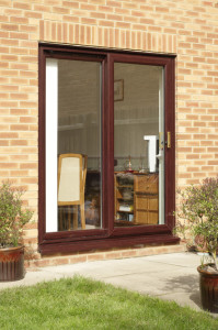 Dark woodgrain uPVC patio door by Anglian Home Improvements myglazing ggf