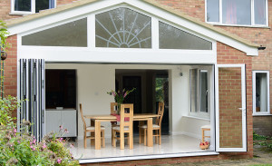 Extension with gable end and open bi-folding doors by Anglian Home Improvements myglazing ggf