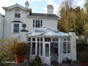 house with conservatory and window film