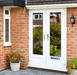white french doors, brick wall and pot plants