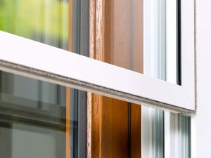 white framed secondary glazing over timber framed window