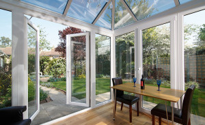 White PVCu conservatory with French doors by Anglian Home Improvements myglazing ggf
