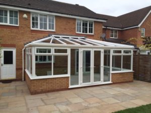 conservatory addition on brick two storey home by westphalia windows