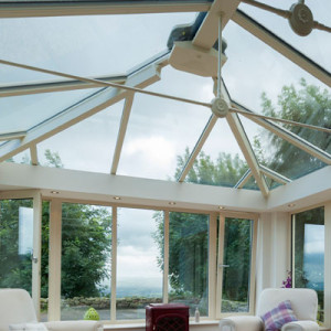 conservatory roof with trees and grey clouds