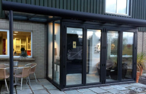 glazed extension to home with black framework