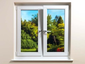 tilt and turn windows by everest limited with garden and blue sky in backgroun