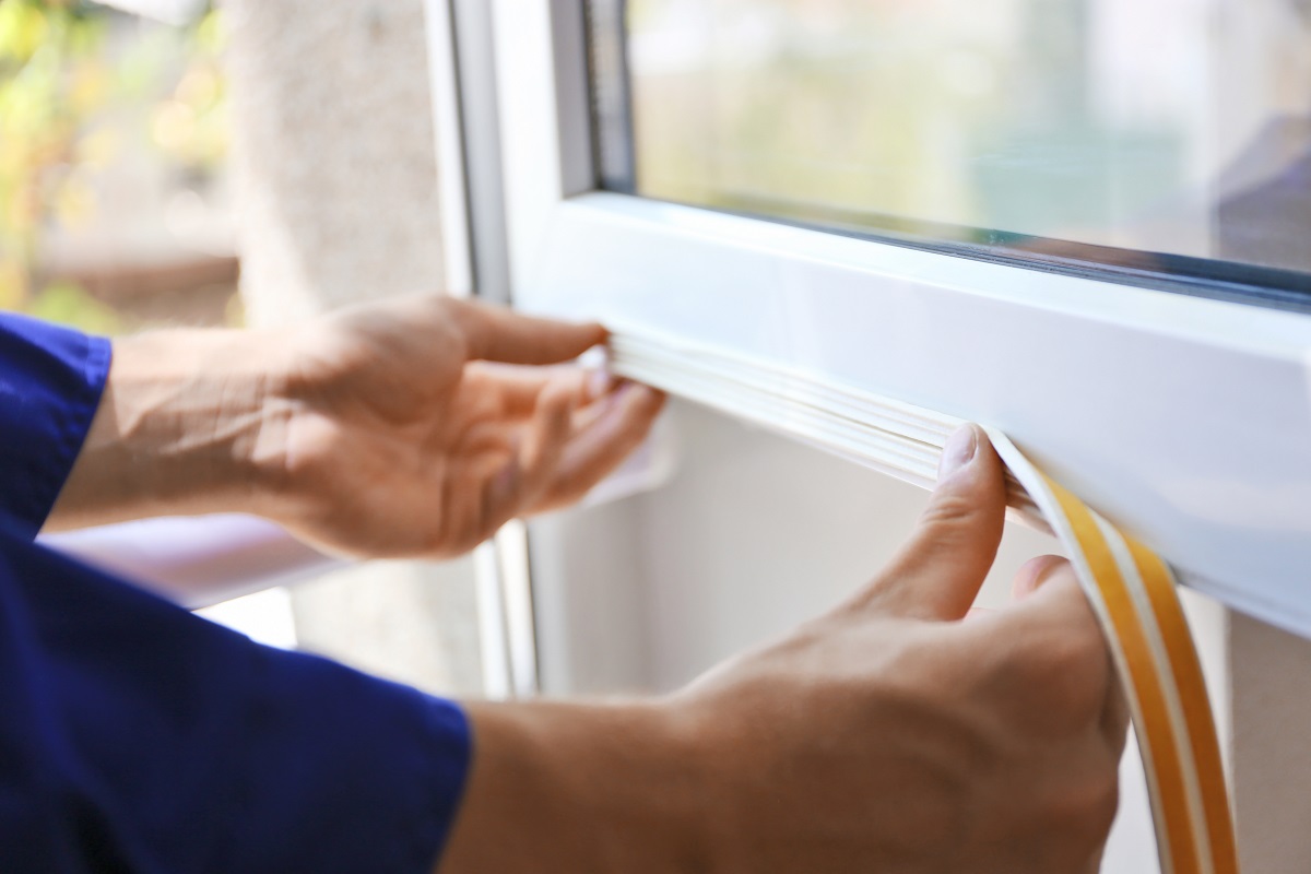 tradesperson installing window